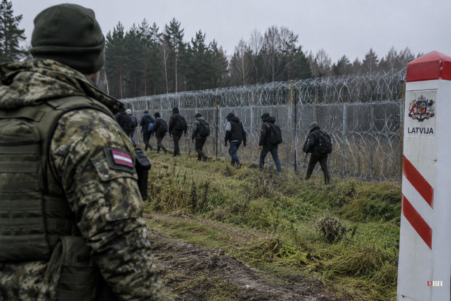 Latvia Says Armed Escorts Drove Migrants at Its Border, Then Masked Men Stole Cameras Hours Later